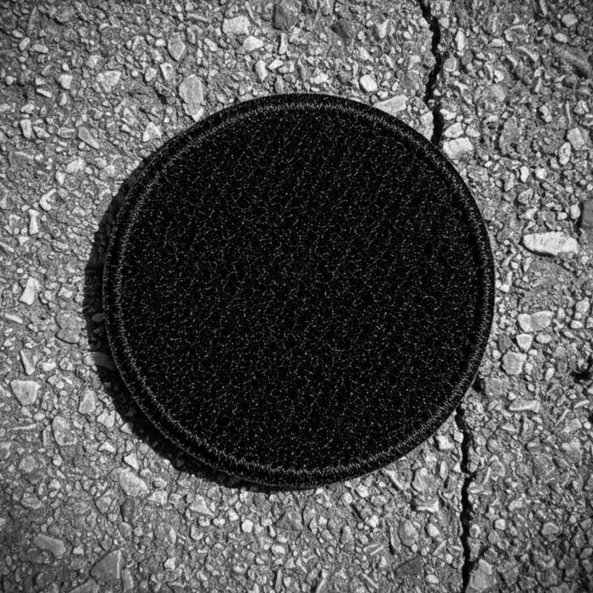 REPATCHED Patch Rückseite mit Hakenklett in runder Form.